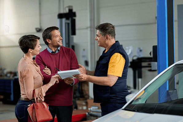 Satisfied customers negotiating with their trusted used car parts supplier